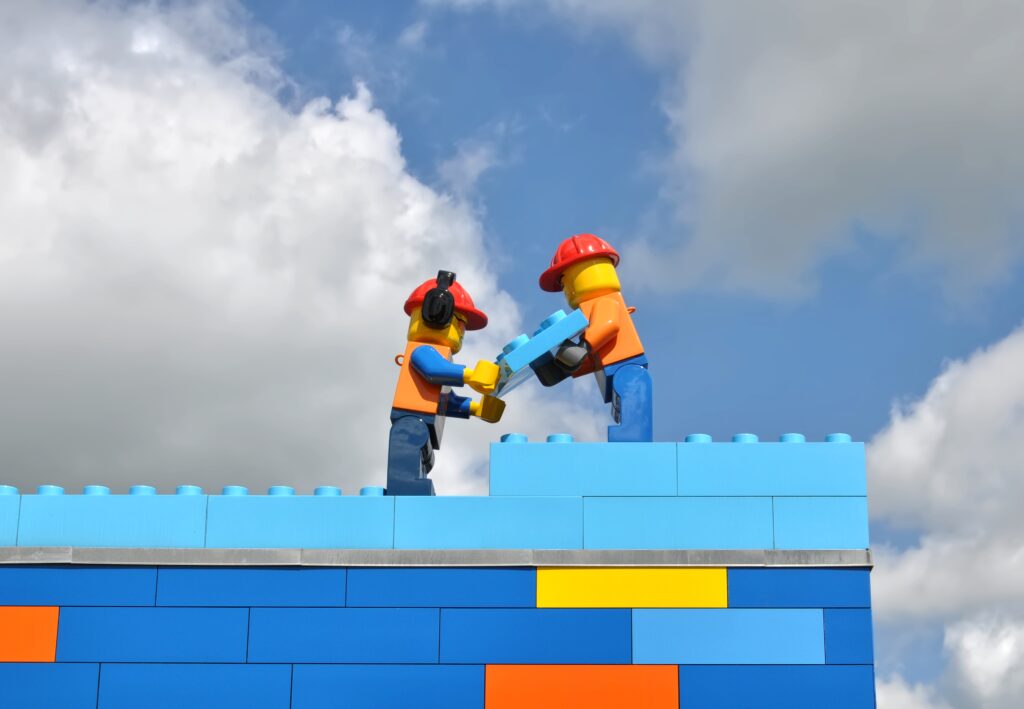 Lego people laying the building blocks for success for brands