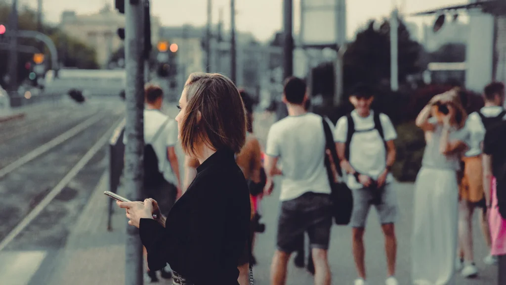 People walking along a busy city street
